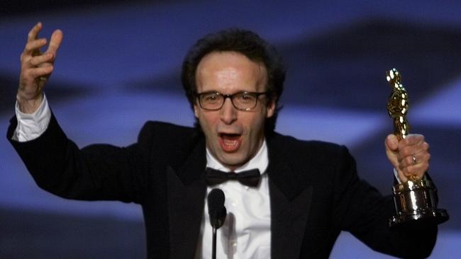 Roberto Benigni holds the Oscar he won for best foreign film, Life Is Beautiful.