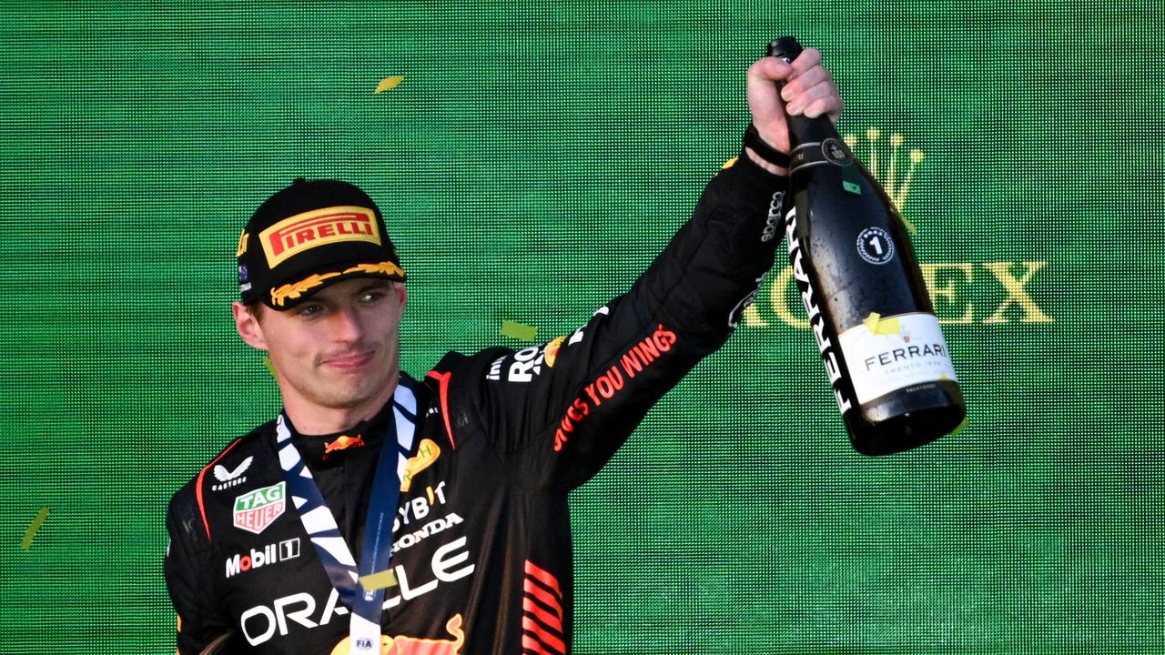 Red Bull Racing's Dutch driver Max Verstappen celebrates on the podium