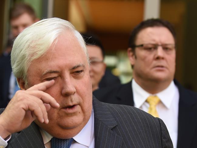 PUP leader Clive Palmer (C) and PUP Senator Glenn Lazarus (R) arrive for a press conference at Parliament House ahead of the Intergeneratiolal Report to be released on Thursday, Canberra, Wednesday, March 4, 2015. (AAP Image/Mick Tsikas) NO ARCHIVING