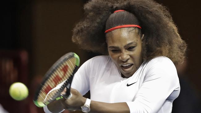USA's Serena Williams returns a shot against the Netherlands during a doubles match in the first round of Fed Cup tennis competition in Asheville, N.C., Sunday, Feb. 11, 2018. (AP Photo/Chuck Burton)