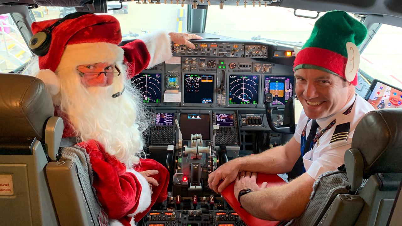 Captain Santa Steve Anderson and helper Ben O’Donnell.