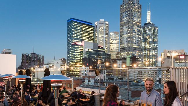 Buzzing at dusk atop Curtain House at Rooftop Bar. Picture: Visit Melbourne