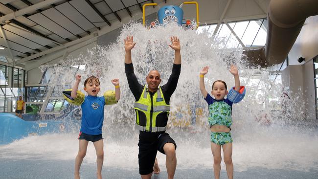 Constable Andrew Titta with twins George and Leonidas having fun at Splash Aqua Park. Picture: George Salpigtidis