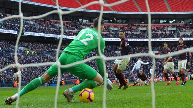 The ball goes under the body of goalkeeper Martin Dubravka as Newcastle conceded a late goal against Tottenham. Picture: AFP