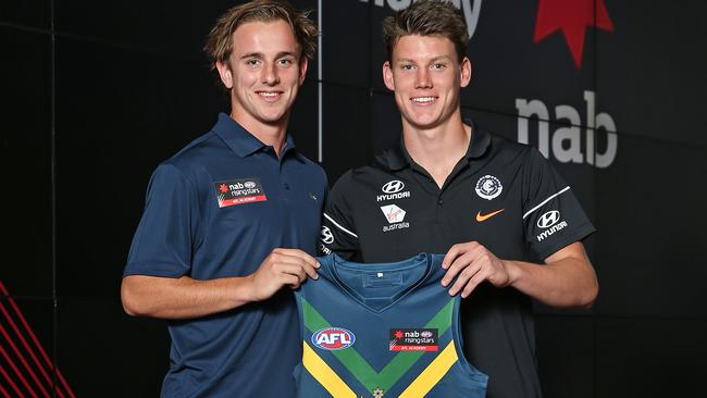 Jackson Mead with Calrlton’s No.1 draft pick Sam Walsh, who presented him with his NAB Academy Guernsey. Picture: Getty Images