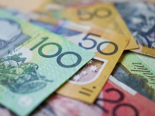 Australian money background showing $100, $50 and $20 notes with a shallow depth of field.