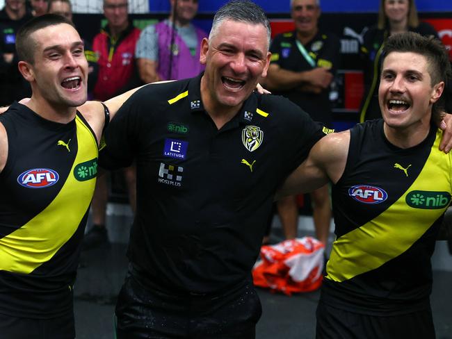 MELBOURNE, AUSTRALIA - MARCH 31:  Jayden Short, Adem Yze and Liam Baker of the Tigers sing the song in the rooms after winning the round three AFL match between Richmond Tigers and Sydney Swans at Melbourne Cricket Ground, on March 31, 2024, in Melbourne, Australia. (Photo by Quinn Rooney/Getty Images)