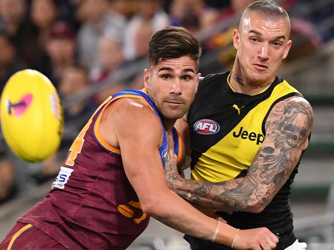 Marcus Adams of the Lions (left) competes with Dustin Martin of the Tigers during the Second Qualifying Final between the Brisbane Lions and the Richmond Tigers during Week 1 of the AFL Finals Series at the Gabba in Brisbane, Saturday, September 7, 2019. (AAP Image/Dave Hunt) NO ARCHIVING, EDITORIAL USE ONLY