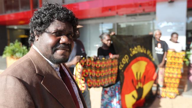 Corben Mudjandi alongside other Mirarr Traditional Owners held a protest outside the Energy Resources of Australia Annual General Meeting of shareholders at the Oaks Darwin Elan Hotel, Wood St over a proposed mine lease extension for Jabiluka. Picture: Zizi Averill