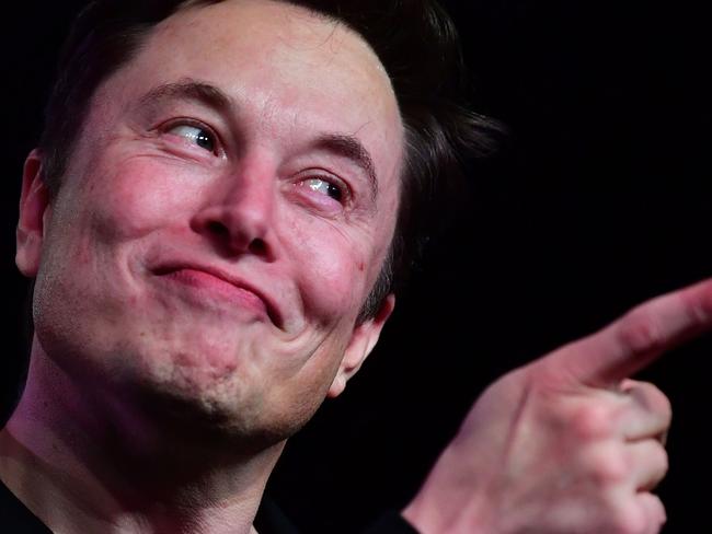 (FILES) In this file photo taken on March 14, 2019 Tesla CEO Elon Musk speaks during the unveiling of the new Tesla Model Y in Hawthorne, California. - A federal judge has cleared the way for a defamation trial against Elon Musk over his comments about a British cave rescuer after rejecting key arguments from the Tesla chief. US judge Stephen Wilson ordered a trial to begin December 3, 2019 in Los Angeles in the case that centers on Musk's tweets in a disagreement connected to the rescue of 12 boys from a cave in Thailand in July 2018. (Photo by Frederic J. BROWN / AFP)