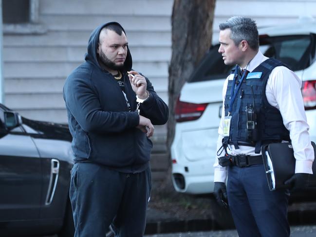 Ali El Nasher after police raided a house in Hope St, Brunswick, in 2018. Picture: David Crosling