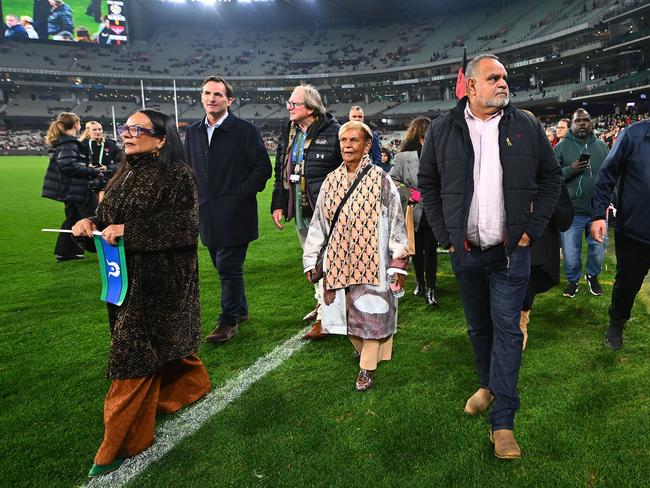 MELBOURNE, AUSTRALIA - MAY 25: Michael Long leads the Long Walk ahead of the round 11 AFL match between Richmond Tigers and Essendon Bombers at Melbourne Cricket Ground, on May 25, 2024, in Melbourne, Australia. (Photo by Morgan Hancock/AFL Photos/via Getty Images)