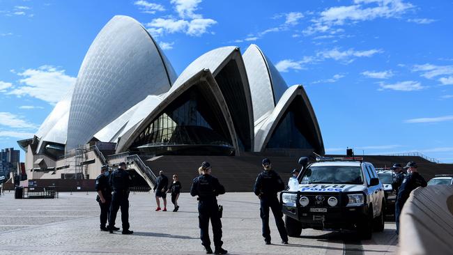 Police officers patrol the Sydney Opera House forecourt. Picture: NCA NewsWire/Bianca De Marchi