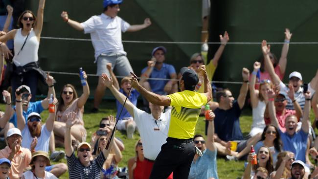 Jason Day celebrates his mighty putt on the 17th with the fans.