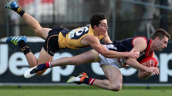 Jason Castagna runs down a Casey opponent. Picture: Mark Dadswell