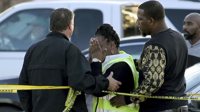 Jefferson Parish Sheriff Newell Normand consoles a woman at the scene.