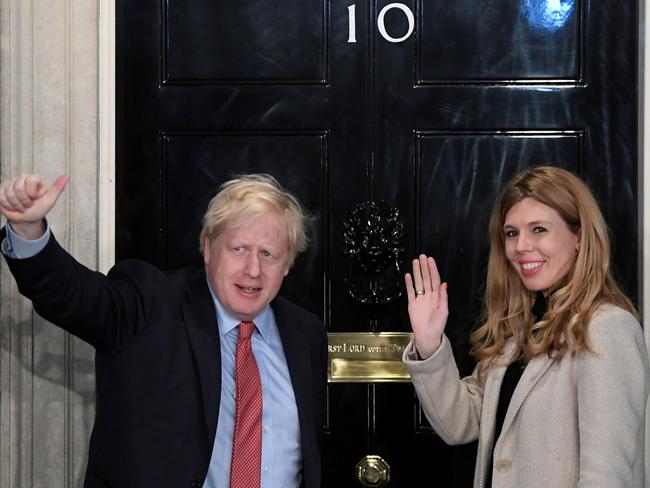 Boris Johnson and his partner Carrie Symonds arrive at 10 Downing Street on the morning after the general election in London. Picture: Reuters