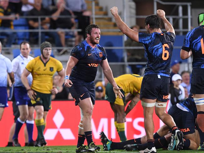 Pumas players celebrate their historic win over the Wallabies.