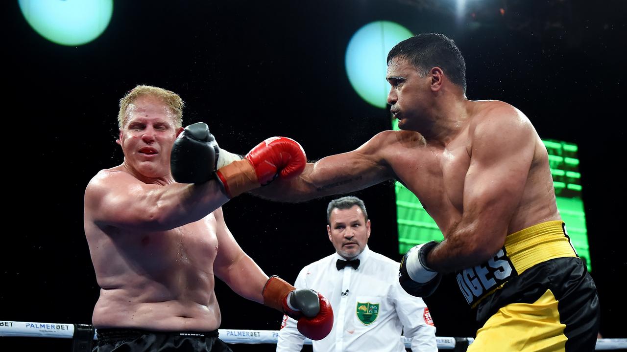 Justin Hodges (R), pictured punching Ben Hannant, is confident he can knockout Paul Gallen. Picture: Albert Perez/Getty Images