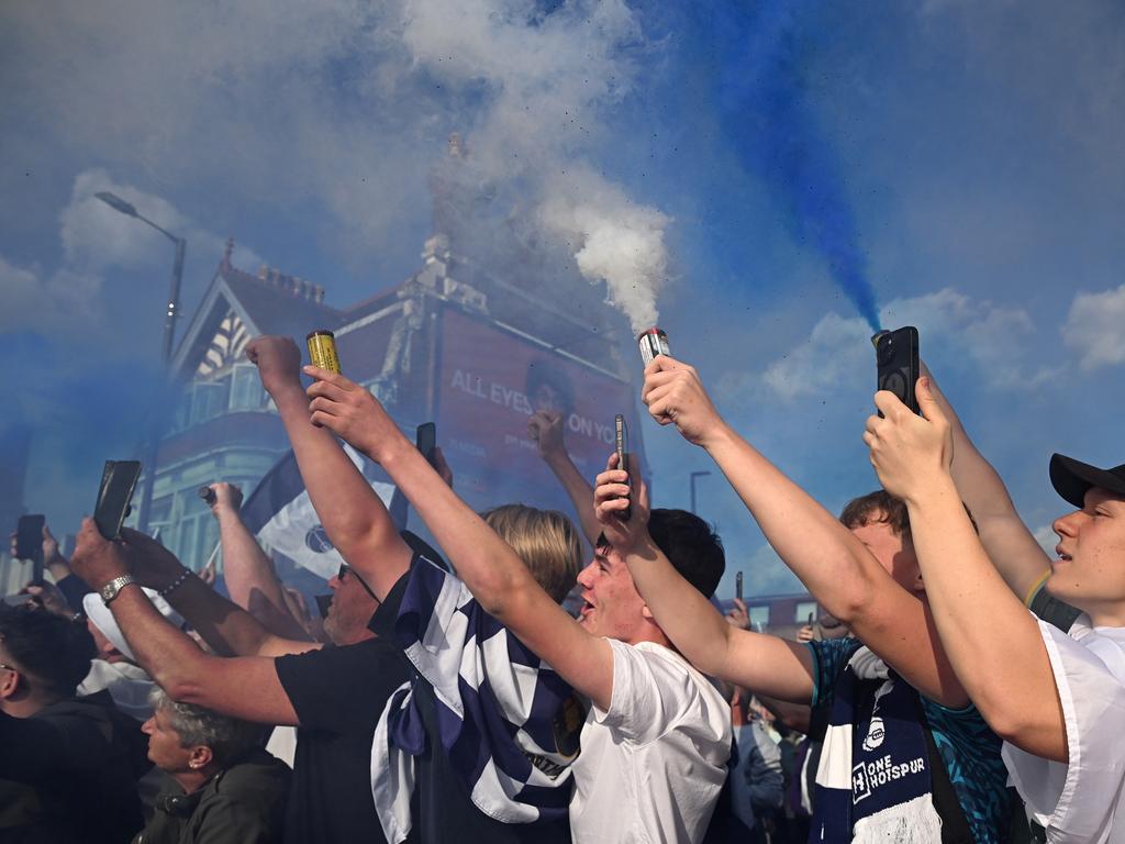 Fans release pyrotechnics as they celebrate during the Tottenham Hotspur UEFA Europa League trophy parade. Picture: Getty Images