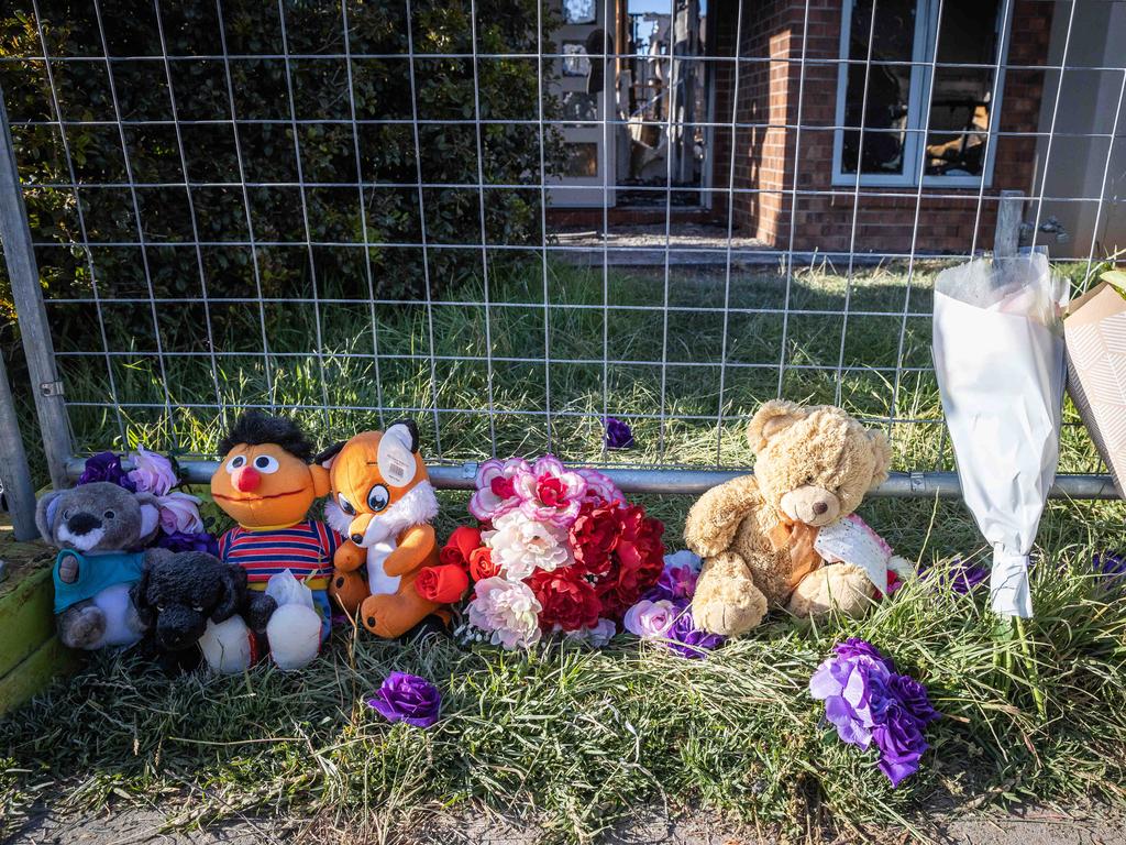Floral tributes have been left at the scene of a tragic house fire in Werribee that claimed the lives of four children. Picture: Jake Nowakowski