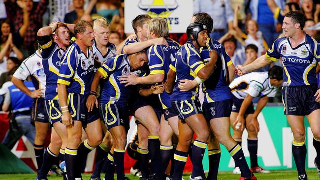 Cowboys players celebrate their breakthrough win over the Broncos in 2004.