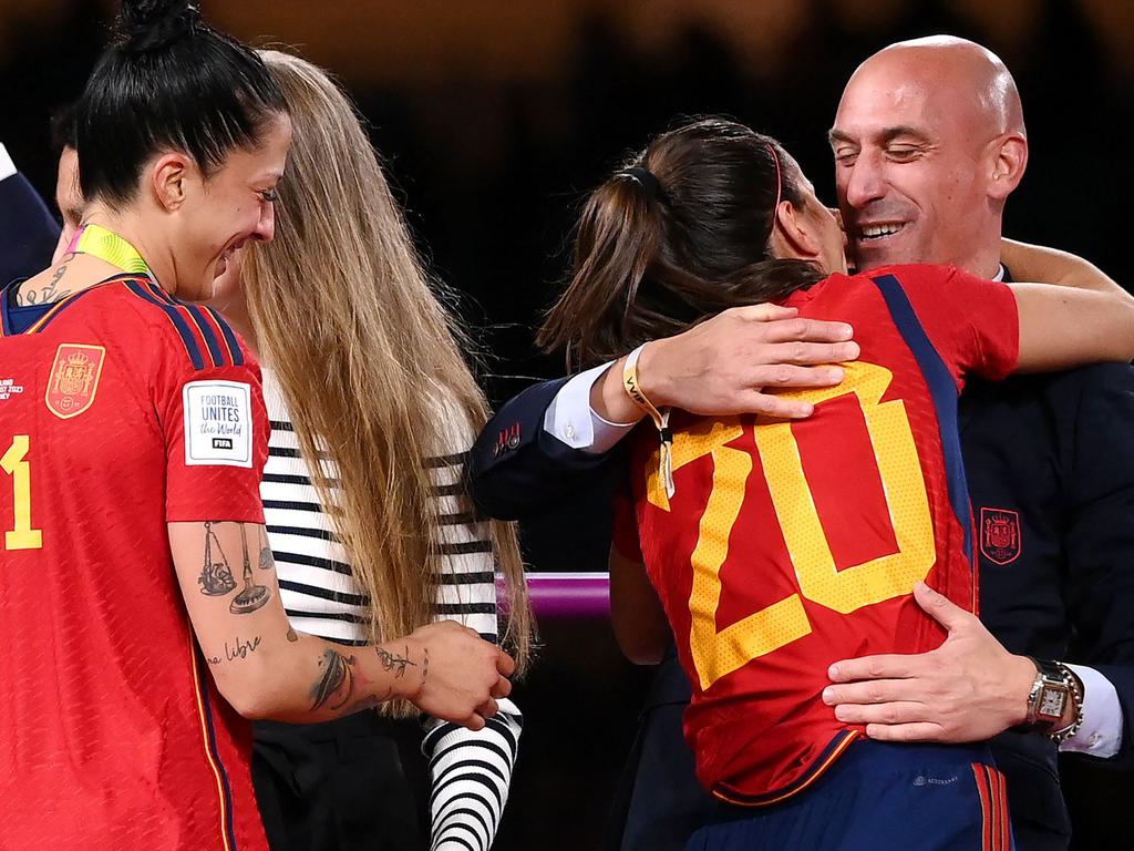 The controversial embrace in Sydney. (Photo by FRANCK FIFE / AFP)