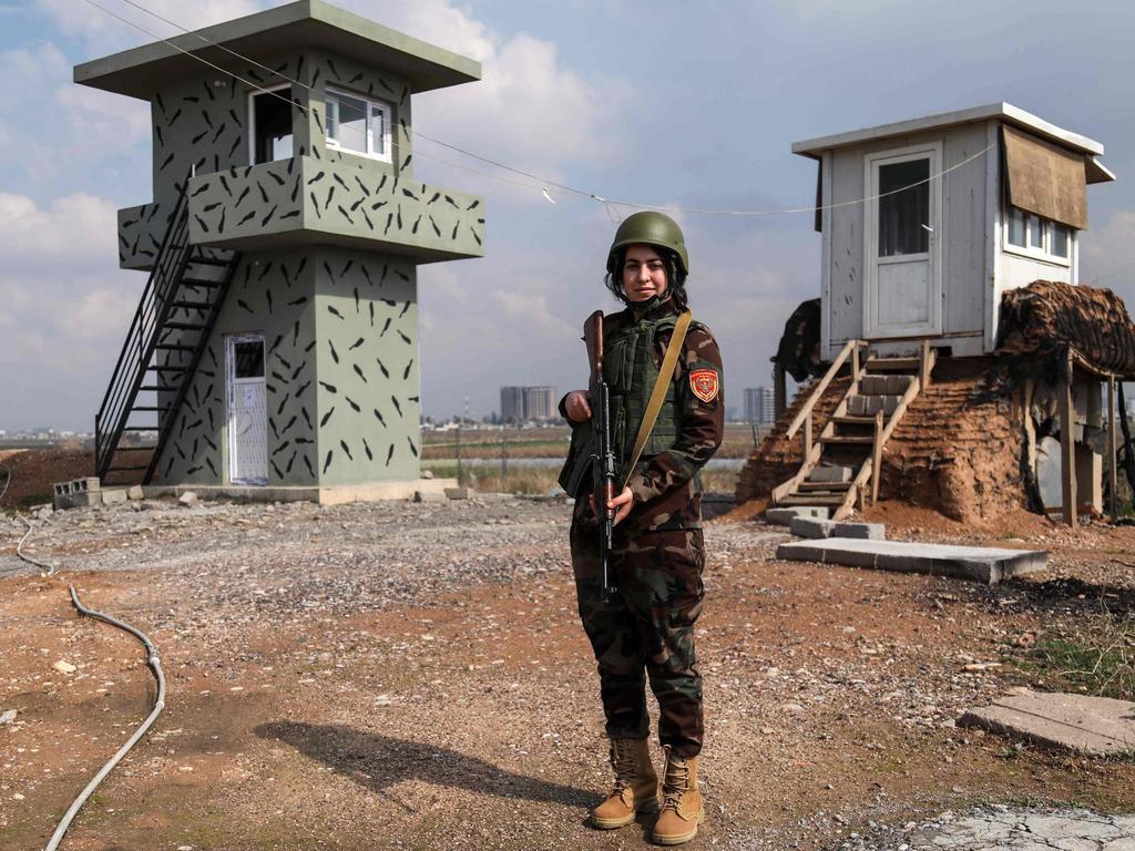 Arazo Qadri, a 27-year-old female member of the Iraqi Kurdish Peshmerga, stands guard at the Peshmerga Military camp in Arbil, the capital of the Kurdish autonomous region in northern Iraq. Picture: AFP