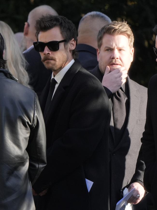 Harry Styles (left) and James Corden (third right) after the funeral service. Picture: PA Images via Getty Images