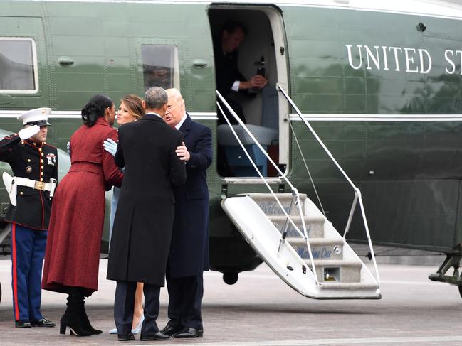 Former President Barrack Obama and Michelle are escorted by Donald and Melania Trump as they leave Capitol Hill on the Marine One helicopter after the swearing-in ceremony for Donald Trump as 45th President of the USA in front of the Capitol in Washington on January 20, 2017. Picture: AFP