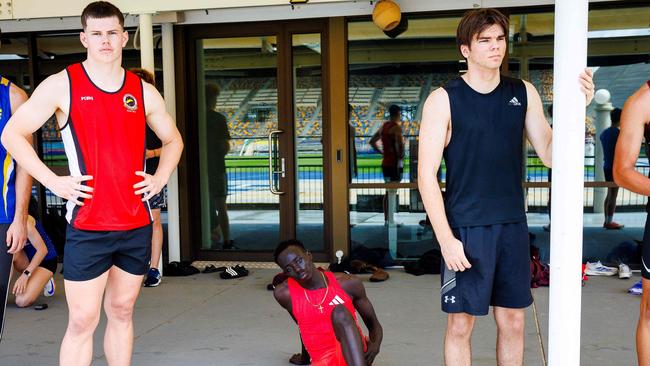 Australian sprinter Gout Gout (C) prepares for the 100m heat.