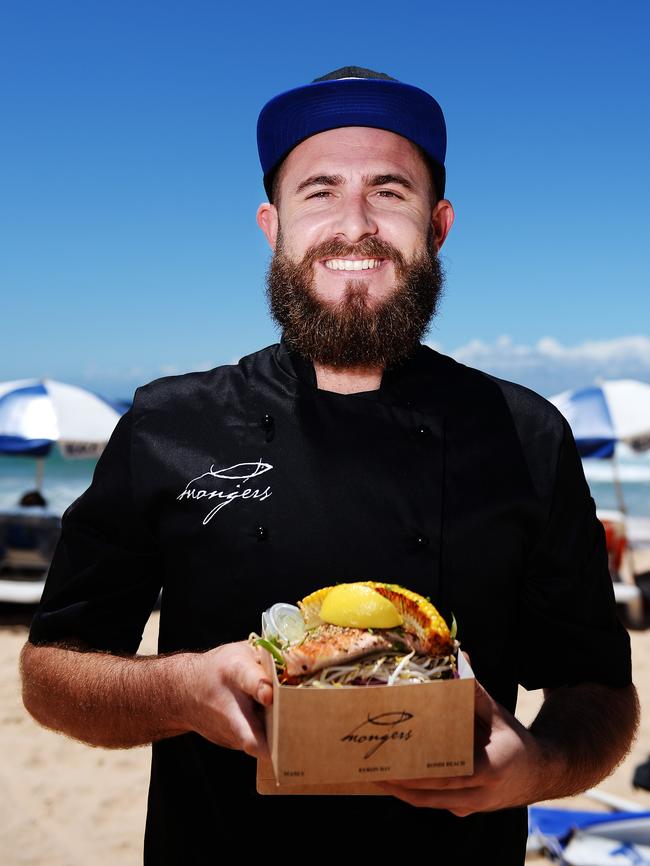 Mongers owner Ryan Mansell with grilled salmon. Picture: Braden Fastier