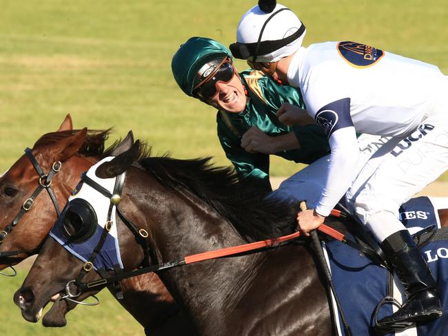 Capitalist ridden by Blake Shinn, wins the Golden Slipper and is congratulated by Zac Purton on Yankee Rose during Golden Slipper day at Rosehill Races. pic Jenny Evans