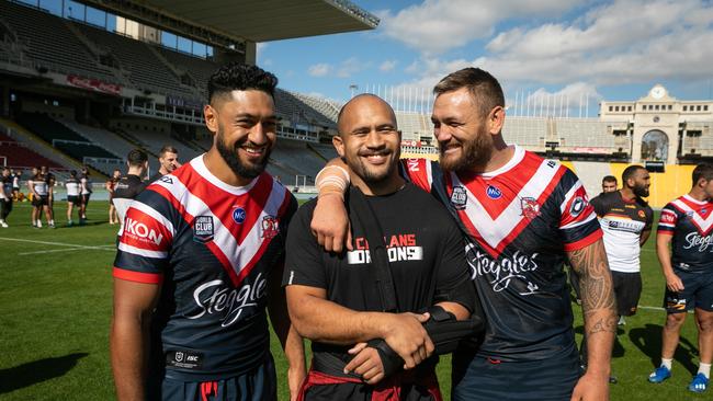 Isaac Liu (left) and Jared Waerea-Hargreaves with former Rooster Sam Moa, who now plays for Catalans in the English Super League.