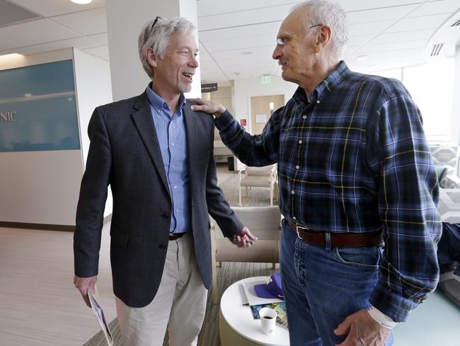 David Maloney of the Fred Hutchinson Cancer Research Center is greeted by patient Ken Shefveland, whose lymphoma was successfully treated with CAR-T cell therapy. Picture: Elaine Thompson