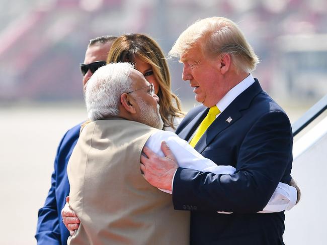 India's Prime Minister Narendra Modi (L) embraces US President Donald Trump upon his arrival at Sardar Vallabhbhai Patel International Airport in Ahmedabad on February 24, 2020. (Photo by MANDEL NGAN / AFP)