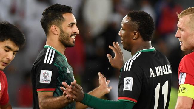 United Arab Emirates' forward Ahmed Khalil (C-R) is congratulated United Arab Emirates' forward Ali Mabkhout (C-L) during the 2019 AFC Asian Cup Round of 16 football match between UAE and Kyrgyzstan at the Zayed Sports City Stadium in Abu Dhabi on January 21, 2019. (Photo by Khaled DESOUKI / AFP)