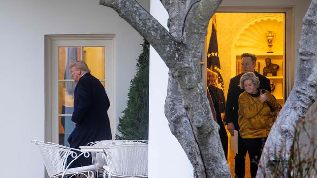 Tesla CEO Elon Musk and White House Chief of Staff Susie Wiles follow US President Donald Trump out of the Oval Office as they depart the White House in Washington, DC, on March 7. Trump went to his Mar-a-Lago resort in Florida. Picture: AFP