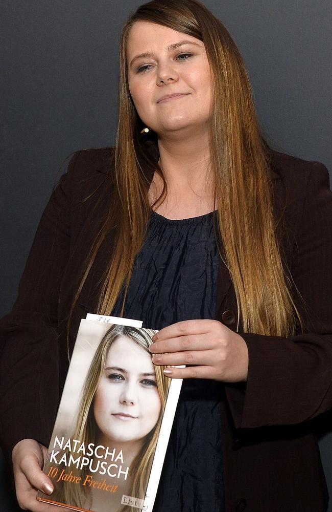 Former Austrian kidnap victim Natascha Kampusch poses with her book 10 Jahre Freiheit — 10 Years Freedom. Picture: AFP