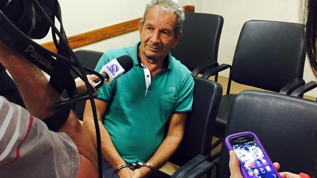 Handcuffed following his arrest Joel Cruz, the former mayor of Taiobeiras, Brazil and a wealthy landowner who auctioned off a 12-year-old virgin girl in his town. Picture: Meninadanca