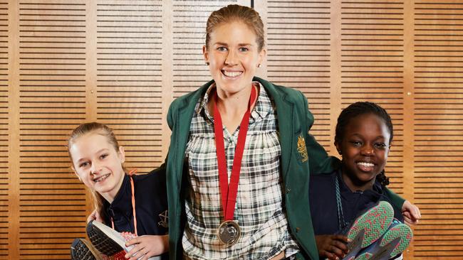 Olympic marathon runner Jess Trengove with St Andrew’s students Elizabeth and Lola. Picture: Matt Loxton