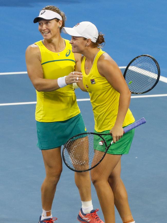 Stosur celebrating a Fed Cup win with Ash Barty. Picture: AAP