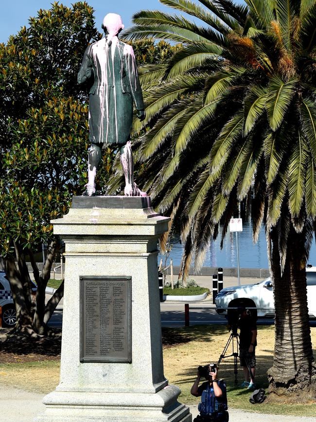 Police take photos of the statue. Picture: Nicole Garmston