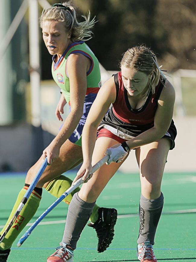 Philly Bridley chased by Jean Flanagan in the DiamonBacks v OHA hockey match at the Tasmanian Hockey Centre, New Town. Picture: MATHEW FARRELL