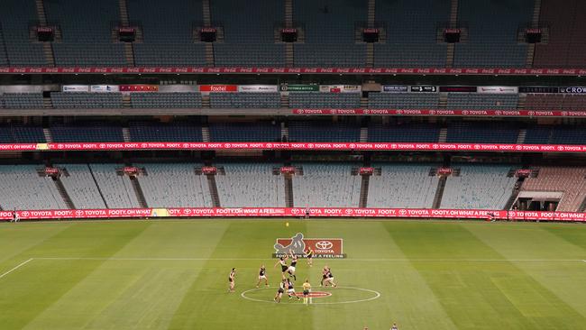 The first bounce of the 2020 AFL season on Thursday, before the league suspended the season. Picture: AAP Image/Michael Dodge