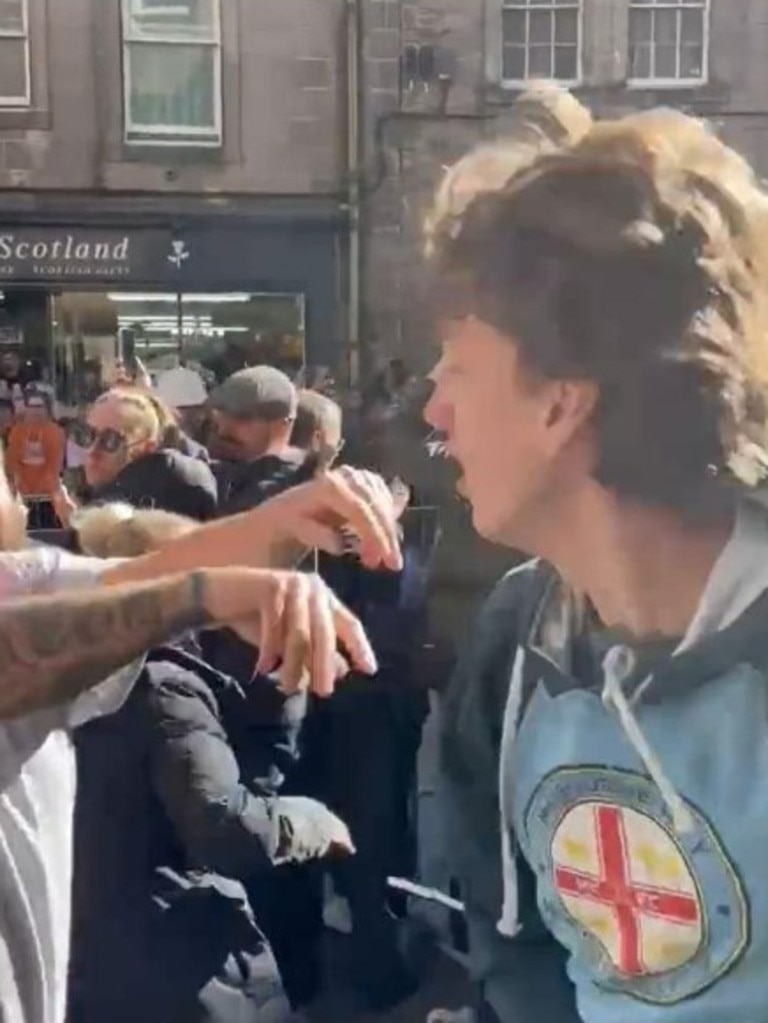 The man, who had a Melbourne City hoodie on, was then shoved by another man. Picture: Christopher Marshall/Holyrood Daily/Twitter