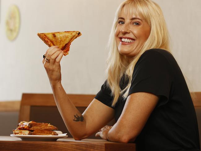 Chloe Gjedsted enjoys a spaghetti jaffle at Lil Siri bar in Chippendale this afternoon. Picture: Sam Ruttyn