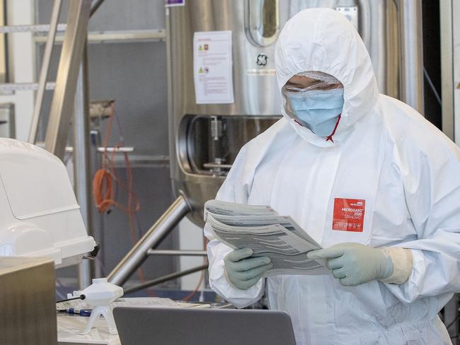 MELBOURNE, AUSTRALIA - NOVEMBER 08: Staff at CSL are seen working in the lab on November 08, 2020 in Melbourne, Australia. CSL will begin manufacturing AstraZeneca-Oxford University COVID-19 vaccine from Monday. (Photo by Darrian Traynor/Getty Images)