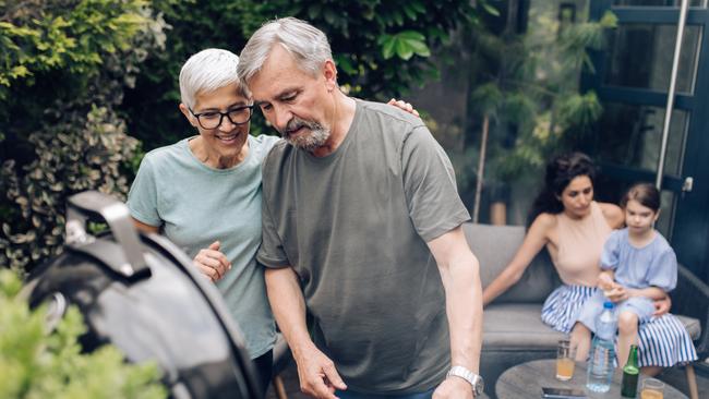 SENIOR/PENSIONER/MATURE/ELDERLY/OVER 65/GRANDPARENT/RETIREE/SUPERANNUATION. Picture: istock Senior couple preparing barbecue for the whole family at the backyard.