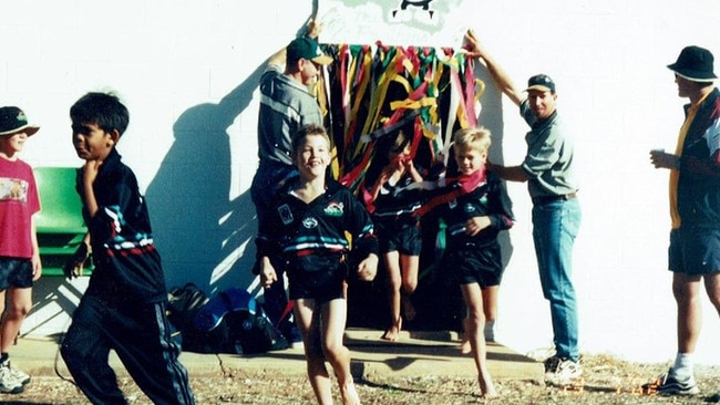 A young Corey Oates runs out for the Baralaba Panthers.